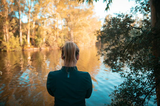 Woman Taking Photos at Sunset in Piedra Aguda Reservoir