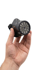 A hand holds a black industrial respirator mask on a, transparent background
