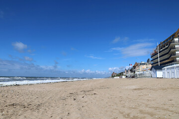 Obraz premium Blonville-sur-Mer Beach with White Beach Huts, Normandy, France. 