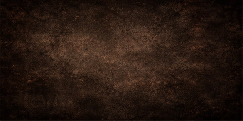 A dark grunge background with an aged brown paper texture and dirty vintage wall pattern creates an antique parchment surface for a blank retro design backdrop