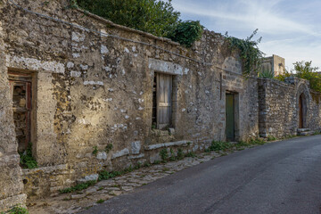 Old Stone Buildings and Rough Paving in a Historic Alleyway in the Medieval Village of Erice, Sicily