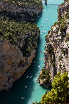 Tourists explore the Verdon Gorge in pedal boats, kayaks and paddle boats. An ideal place for an active holiday in Provence-Alpes-C&ocirc;te d'Azur, France.