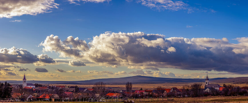 Churches of a small Bakony village, with Kab Mountain in the background