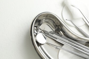 Many different dental tools on white table, flat lay. Space for text