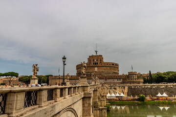 Famous tourist attraction of castel Sant Angelo fortress and bridge over the Tiber river in Rome, Italy near the Vatican