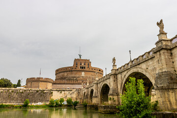 Famous tourist attraction of castel Sant Angelo fortress and bridge over the Tiber river in Rome, Italy near the Vatican