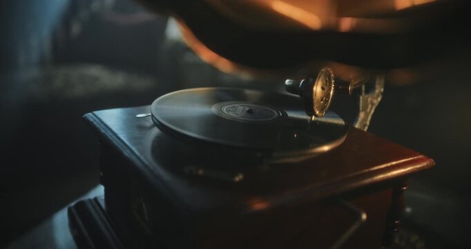 Old phonograph being cranked as needle moves across record, closeup