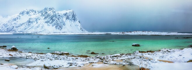 Amazing snowy winter scene of  Vestvagoy island with snowy  mountain peaks on Lofoten Islands . © pilat666