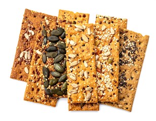 Stack of rectangular seeded crackers atop white background, viewed from above, macro food