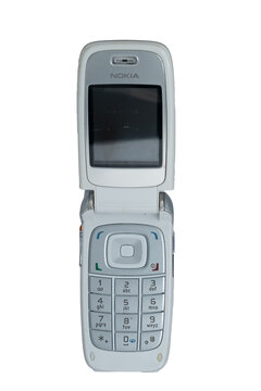 Madrid, spain 20 february 2026. Nokia flip phone isolated on white background, representing retro wireless communication
