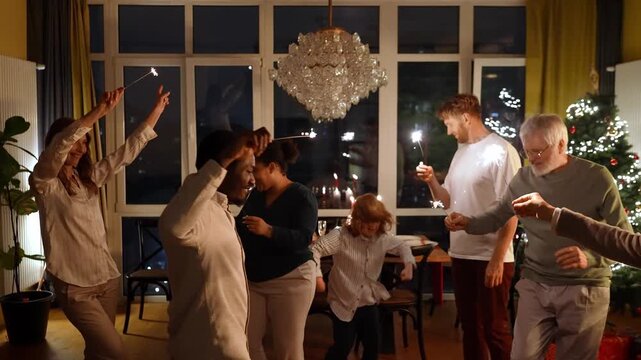Family and guests dancing and holding sparklers