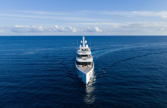 Aerial view motorboat. Luxury lifestyle. Vacation on summer. Yacht at sea. Motorboat aerial top view. Luxury boat motor yacht at sea. Yachting boat tourism. Motorboat gliding through the sea