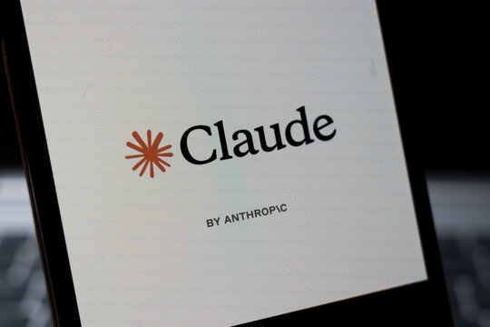Warsaw, Poland - Feb 24, 2026: Close-up of a mobile phone screen displaying the Claude logo by Anthropic, a technology brand offering AI solutions for various applications.