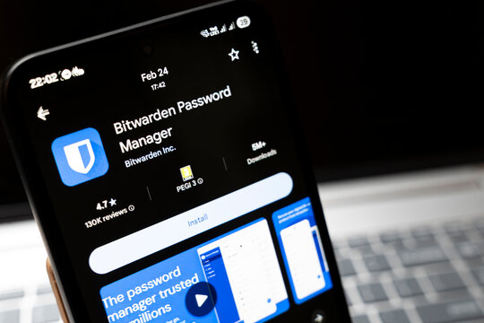 Warsaw, Poland - Feb 24, 2026: A close-up view of a smartphone screen displaying the Bitwarden Password Manager application, showcasing download options and ratings.
