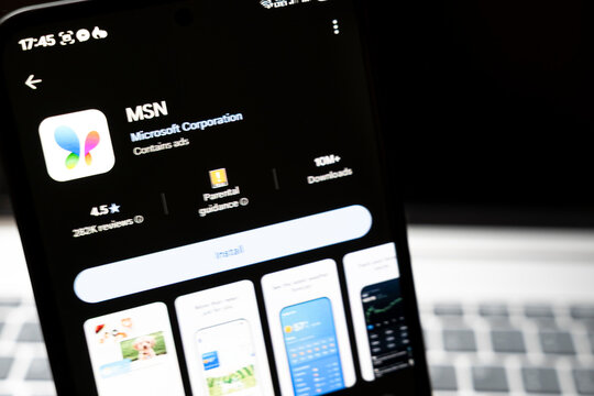 Warsaw, Poland - Feb 24, 2026: Close-up of a smartphone screen displaying the MSN app by Microsoft Corporation, showcasing user reviews, download count, and interface elements.