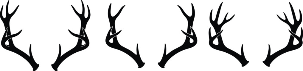Collection of black deer antler silhouettes, rustic hunting trophies, buck horns icon set, wildlife nature design elements, isolated reindeer antlers vector, forest animal © Junayid