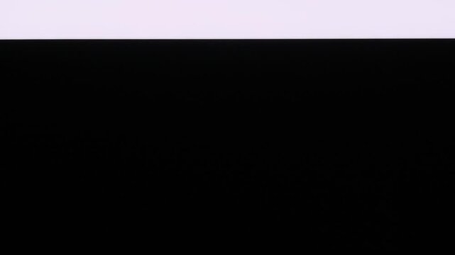 Glowing white horizontal strip of light moves vertically from bottom to top on a black background. This abstract concept simulates a photocopier scanner beam or digital glitch.