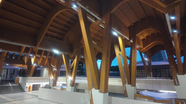 Centro Direzionale Metro Station (Stazione Centro Direzionale). Naples, Italy. Designed by Benedetta Tagliabue (EMBT), featuring dramatic Glulam timber structure contrasting modern skyscrapers.