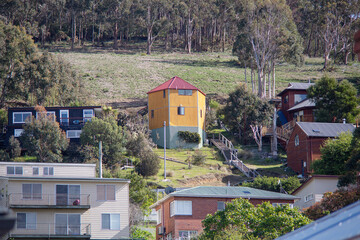 Looking up a hill at a variety of residential properties in South Hobart, Tasmania