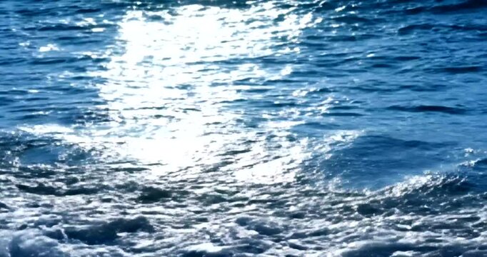 Ocean Waves Crashing with Sunlight Reflection.