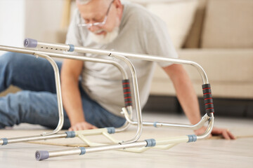 Walker against senior man after fall at home, closeup