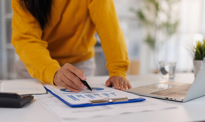 Fototapeta na wymiar Accounting company provide finance and taxation planning for profitable cash flow, Auditor and accountant team working in office, analyze financial data and accounting record with calculator.Insight