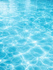 Fototapeta premium Close-up of swimming pool water surface with sunlight reflections, abstract blue water texture background, clean minimal luxury wellness concept, high resolution professional stock photo