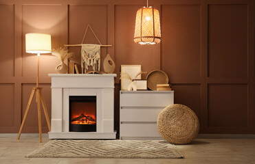 Fototapeta premium Interior of cozy room with glowing lamps, dresser and stylish fireplace