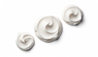 Three whipped cream dollops isolated on light neutral background, smooth creamy dessert topping texture in minimalist top view composition with copy space