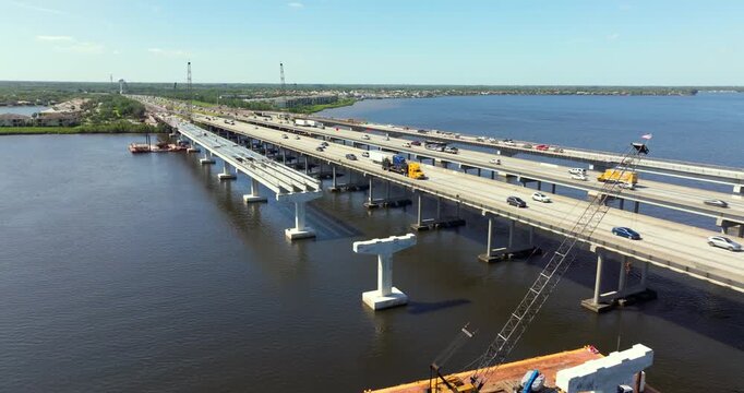 Roadworks construction site on American highway bridge. Expanding infrastructure for cars driving across the Trooper J D Young Memorial Bridge crossing the Manatee River in Ellenton, Florida.