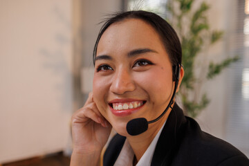 Leave the hard work to me. Shot of an attractive young saleswoman sitting alone in the office and...