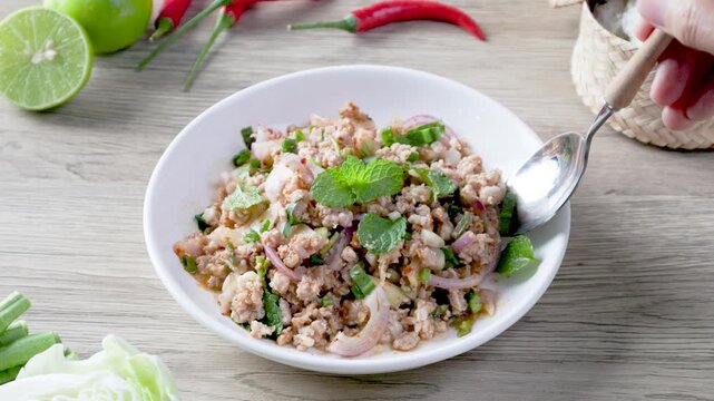 Thai spicy minced pork salad or laab moo in Isan Thai food style