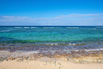 Landscape of calm ocean and blue sky. Summer tropical turquoise sea.