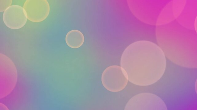 Soft pastel bokeh background with colorful circular light orbs