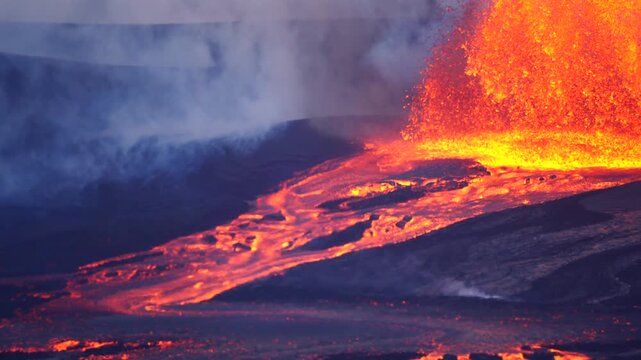 Close up slow moving lava flow descending a slope creating a mesmerizing natural pattern