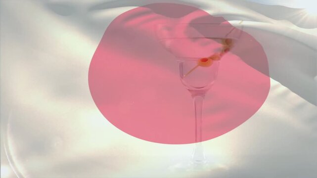 White flag with red disk fluttering from breeze, folds rippling and disk warping to show creases