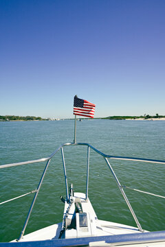 American flag on a boat on the water