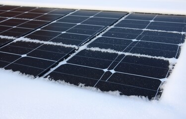 Winter morning snow cleared all black panels on sloped roof