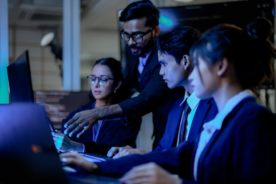 Cybersecurity analysts executing threat mitigation protocols in security operations center. IT specialists monitoring network firewall intrusion detection.