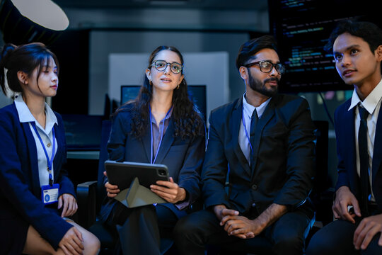 Fintech analysts evaluating algorithmic trading patterns via digital tablet dashboard. Corporate strategists discussing blockchain ledger integration solutions.