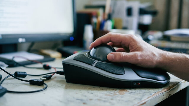 Assistive technology mobility neuro control disability desktop workspace hand trackball device focus productivity independence support