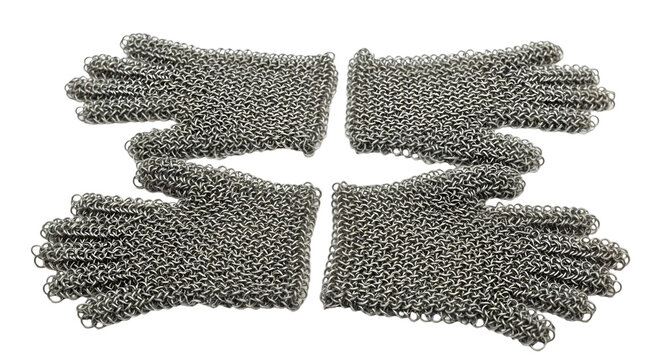 Four pairs of metal chainmail gloves on transparent background for protection and medieval costume