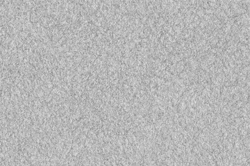 Fototapeta premium Felt background texture. Grey high resolution seamless fabric fibre closeup.