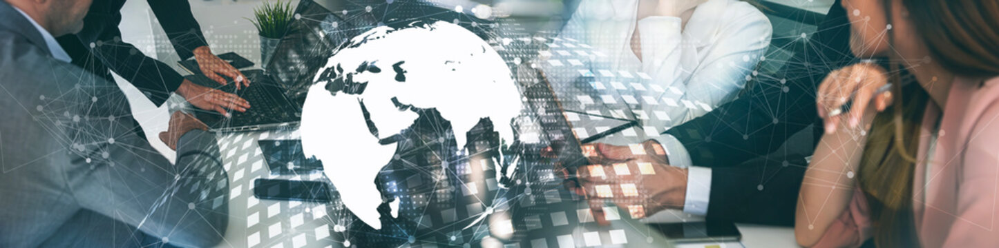 Global Business Strategy and International Teamwork Concept, Corporate Professionals Collaborating with Digital World Globe and Network Data Overlay.
