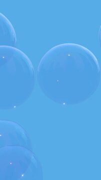 Transparent Soap Bubbles Floating Upwards Against a Clear Blue Sky