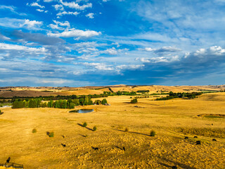Cloud‑Laced Skies at Golden Hour Over Farmland