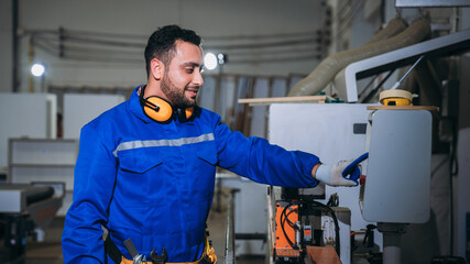Professional Woodworker Measuring, Cutting and Installing Timber in Factory. Carpentry and Wood Manufacturing Process in Industrial Workshop