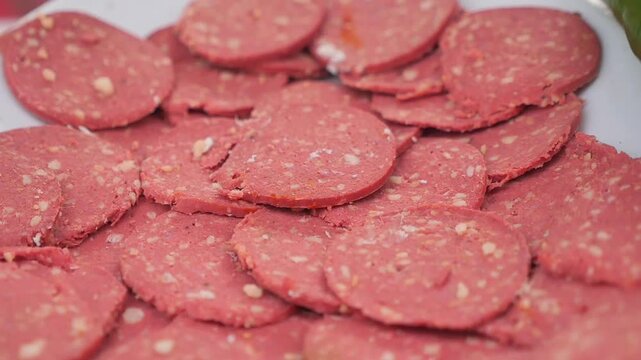 Close-up of Sliced Salami on a White Plate