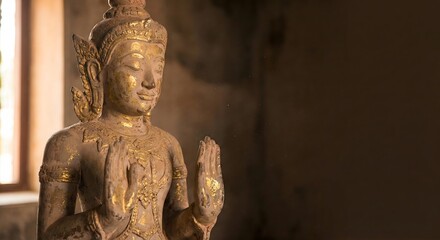 Golden Buddha statue in a dark temple setting with dramatic cinematic lighting