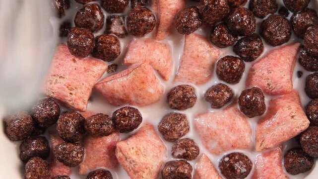 Morning cereal mix with milk in a bowl at home